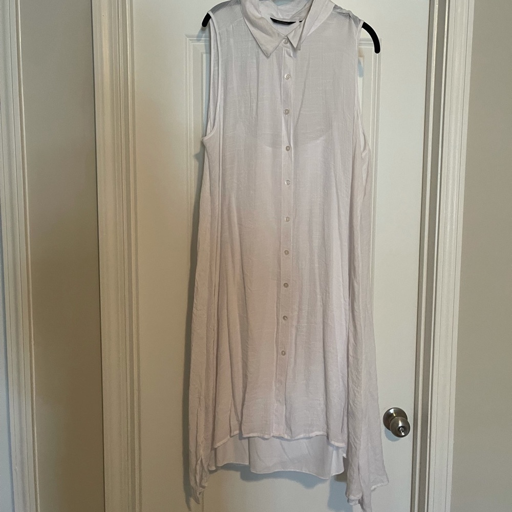White sheer, sleeveless top, with attached cami. 🤍You’ll love it!🤍